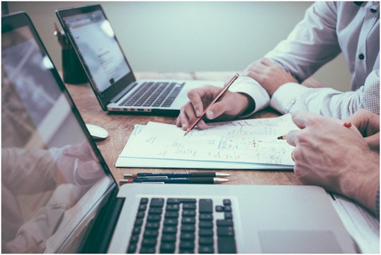 Business professionals go over data produced from treemap charts